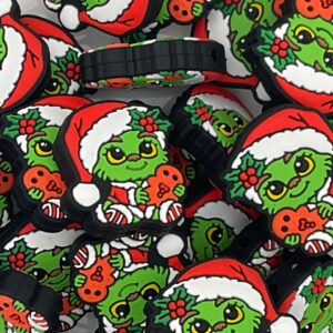 Baby Christmas Grouch holding gingerbread